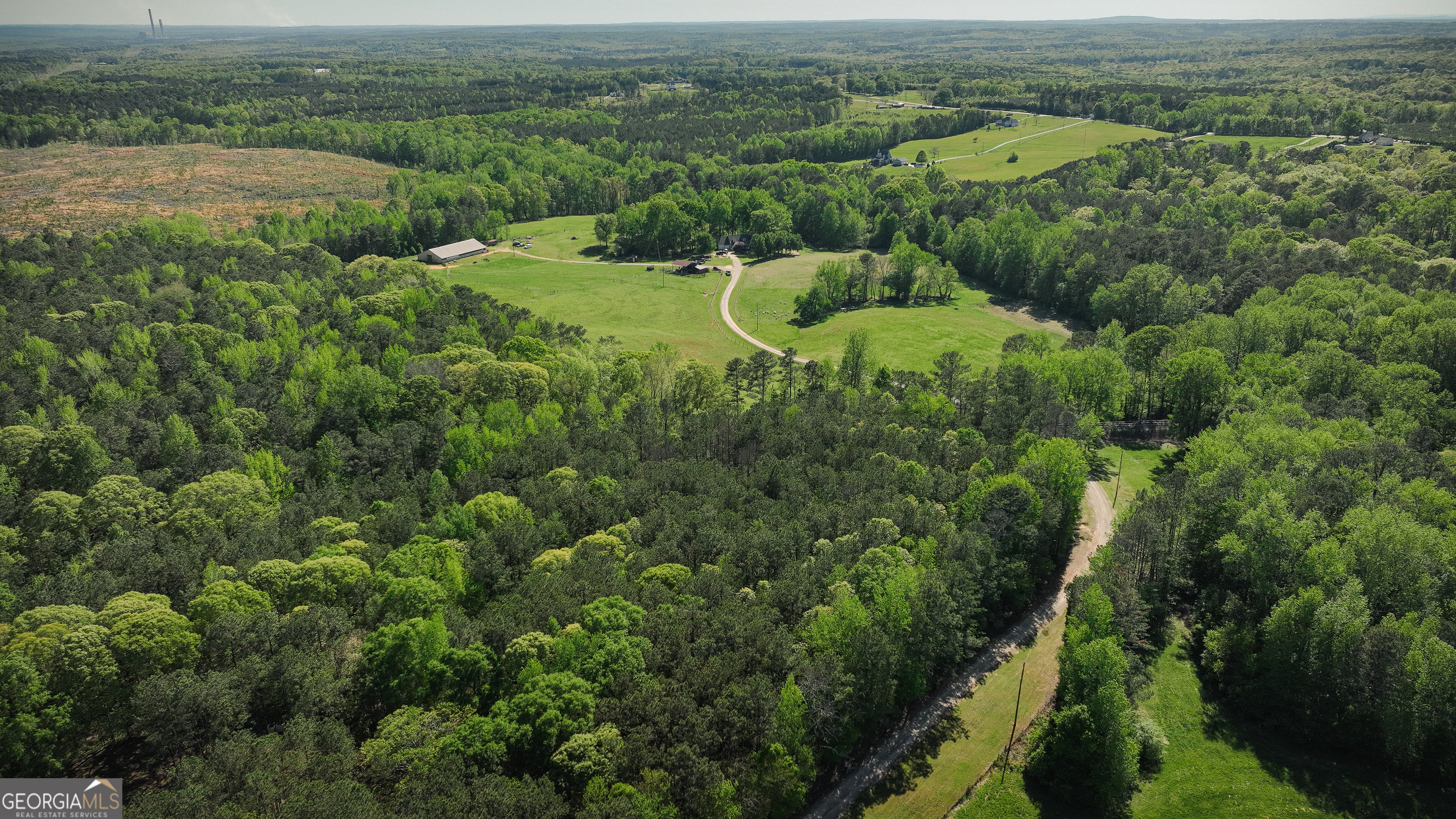 201 Little New York Road Carrollton, GA 30116 - Photo 19 of 29 an aerial view of green landscape with trees all around