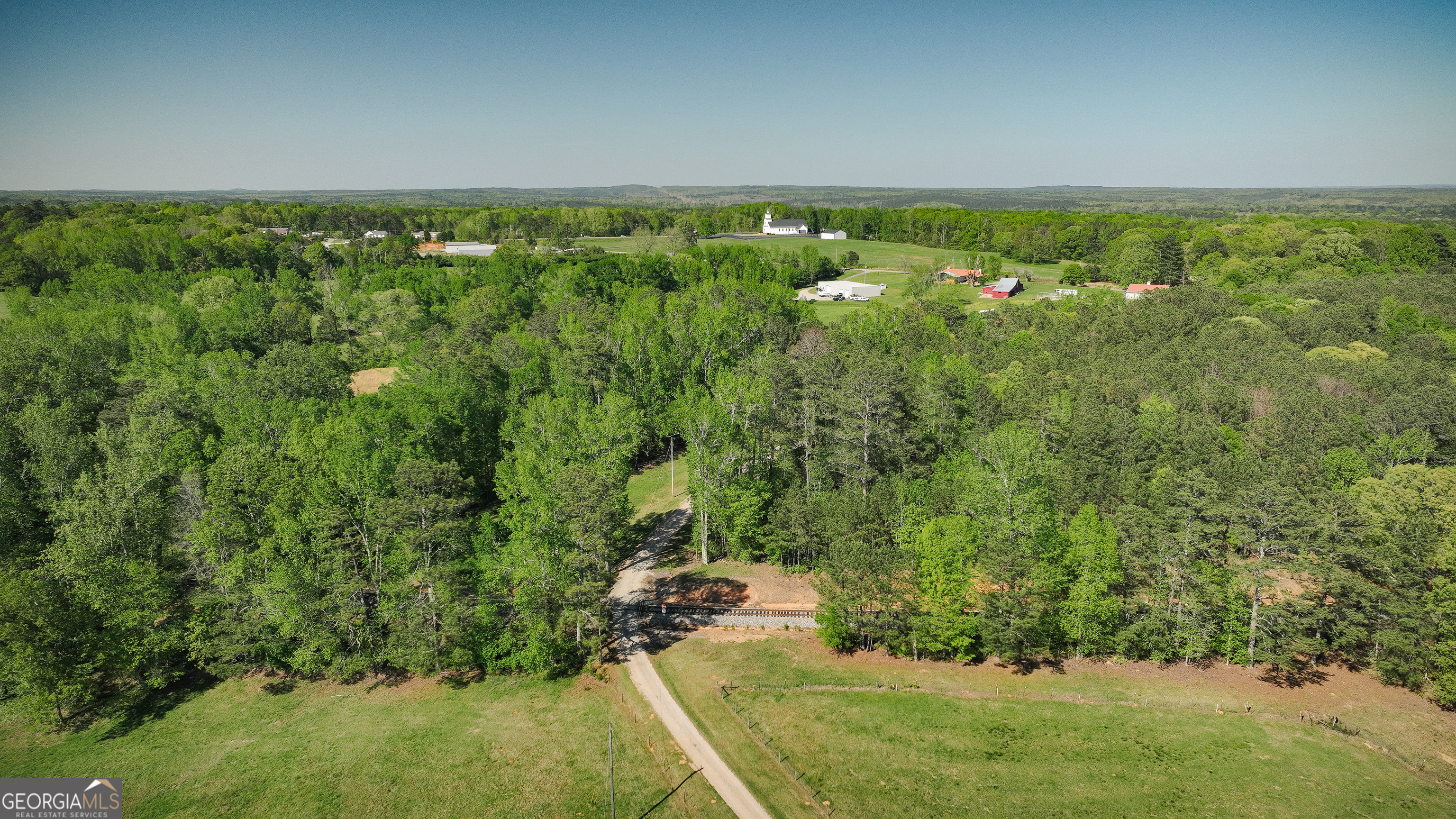 201 Little New York Road Carrollton, GA 30116 - Photo 21 of 29 a view of a green field with lots of bushes
