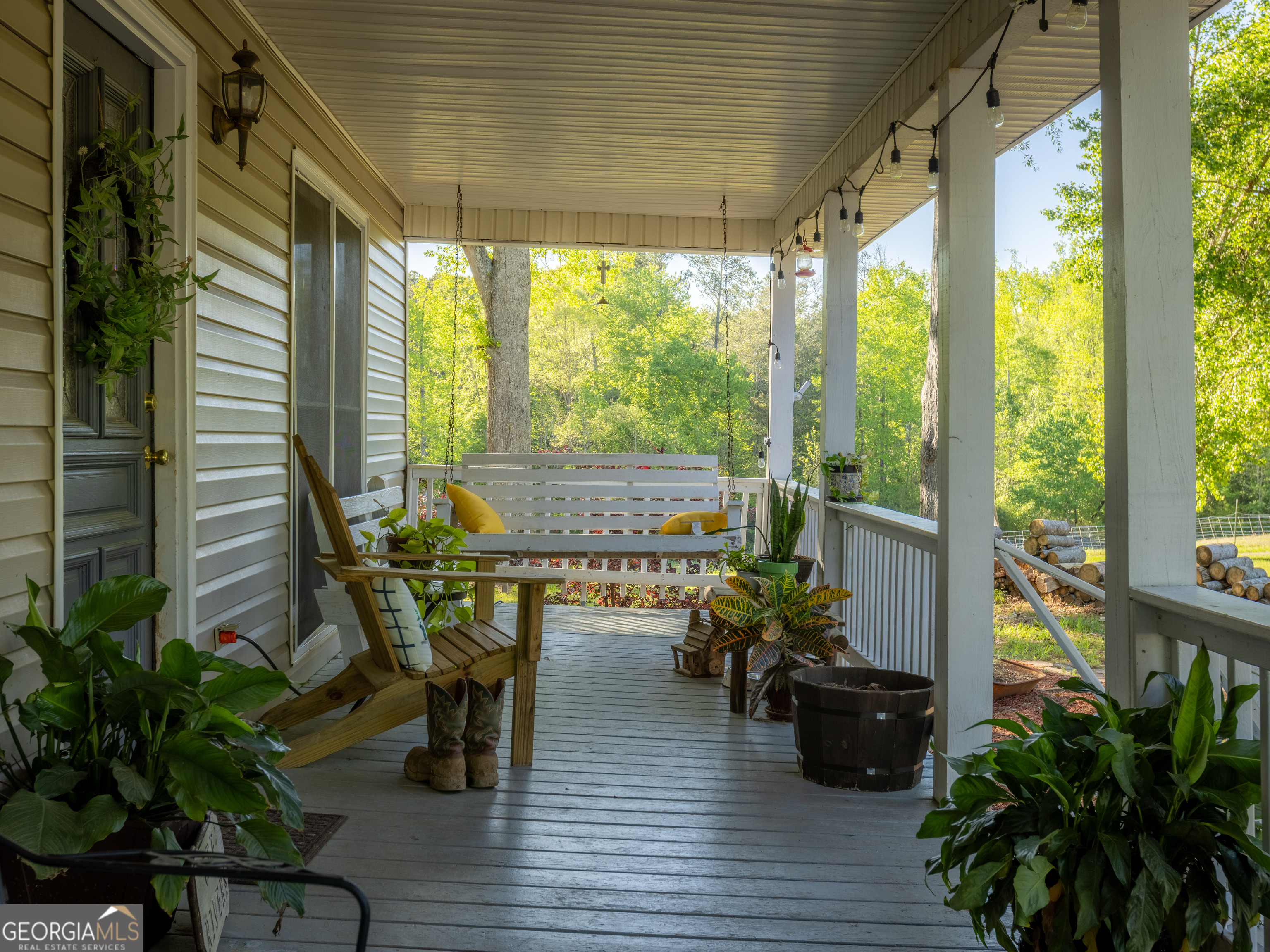 201 Little New York Road Carrollton, GA 30116 - Photo 22 of 29 a view of a porch with furniture and wooden floor