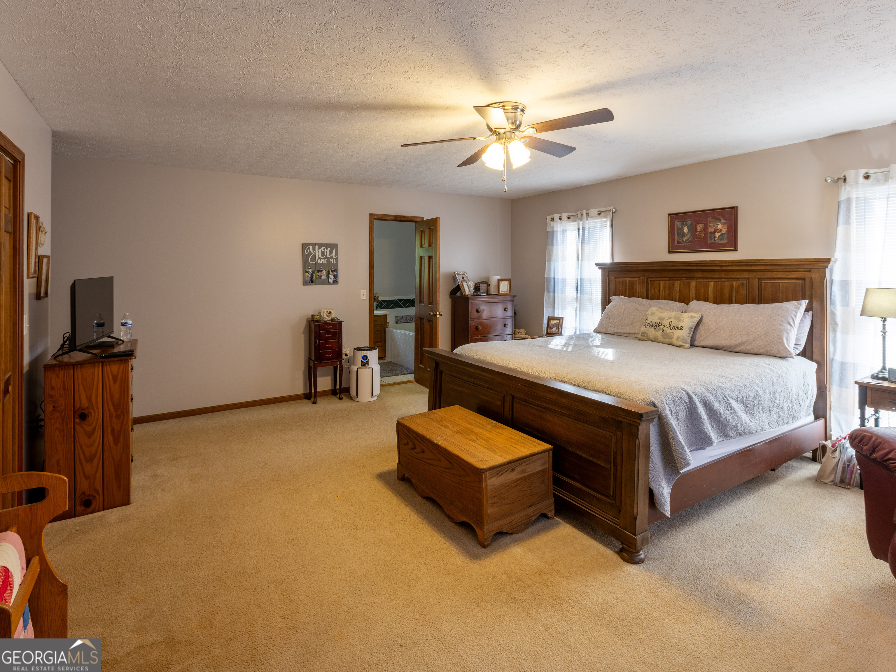 201 Little New York Road Carrollton, GA 30116 - Photo 26 of 29 a bedroom with a bed and ceiling fan