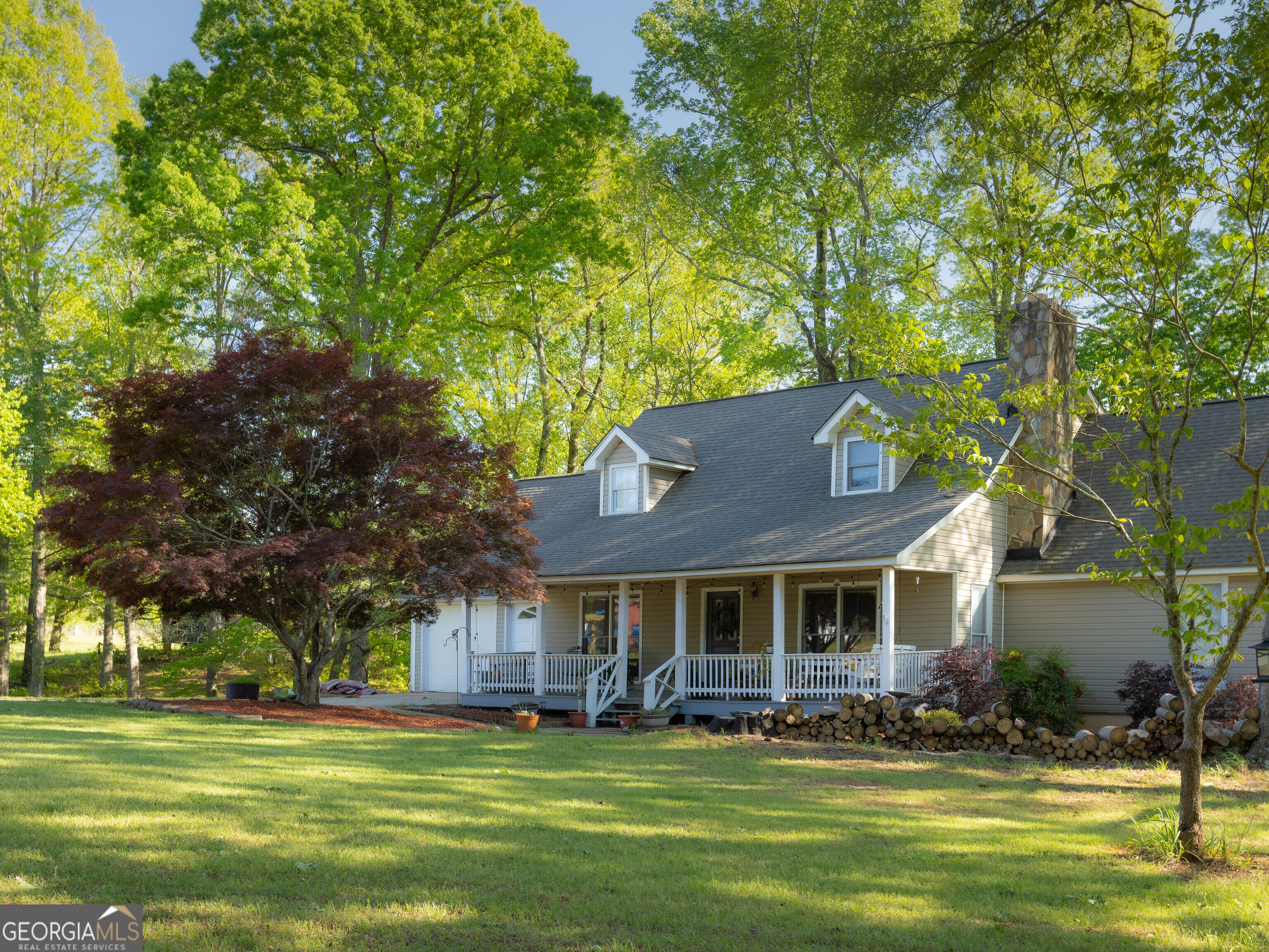 201 Little New York Road Carrollton, GA 30116 - Photo 4 of 29 a front view of a house with a garden