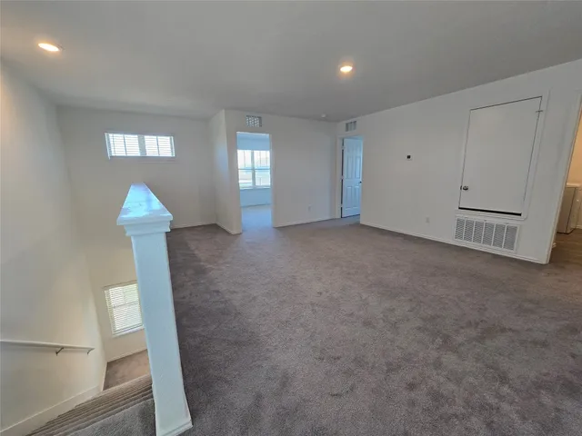 a view of empty room with windows