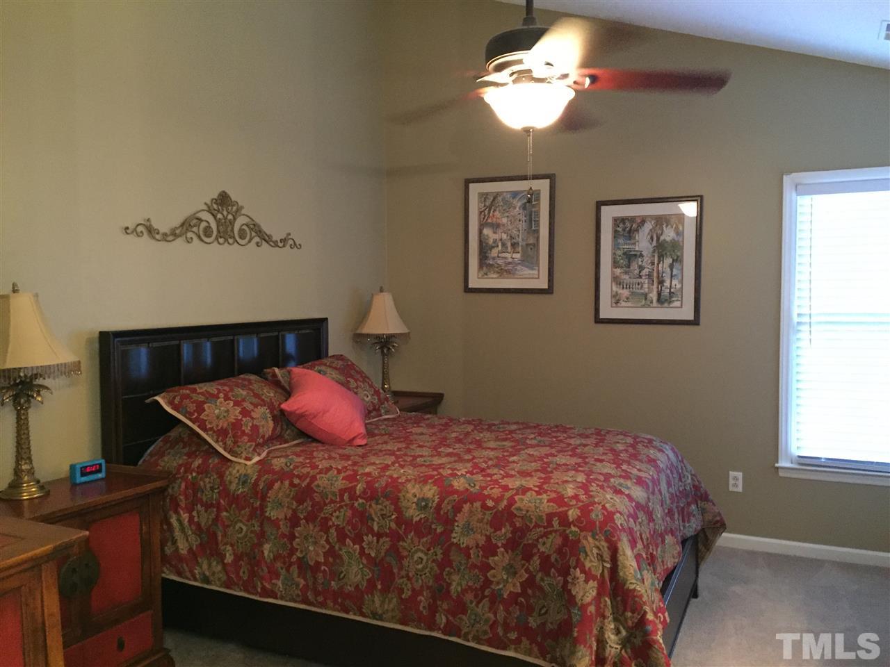 11917 Eagle Bluff Circle Raleigh, NC 27613 - Photo 14 of 25 a bedroom with a bed and a window