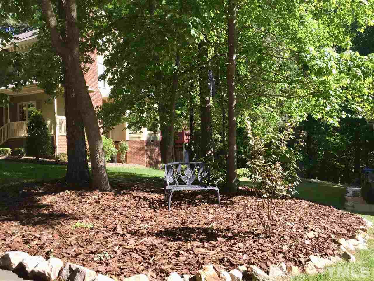 11917 Eagle Bluff Circle Raleigh, NC 27613 - Photo 3 of 25 a backyard of a house with lots of green space