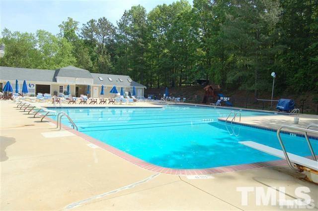 11917 Eagle Bluff Circle Raleigh, NC 27613 - Photo 22 of 25 a view of a swimming pool with a patio
