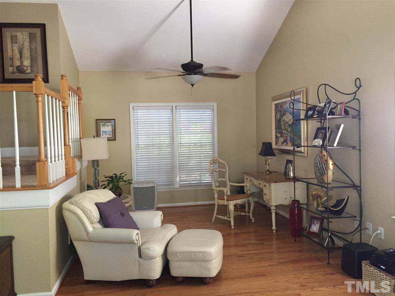 11917 Eagle Bluff Circle Raleigh, NC 27613 - Photo 7 of 25 a living room with furniture and a window