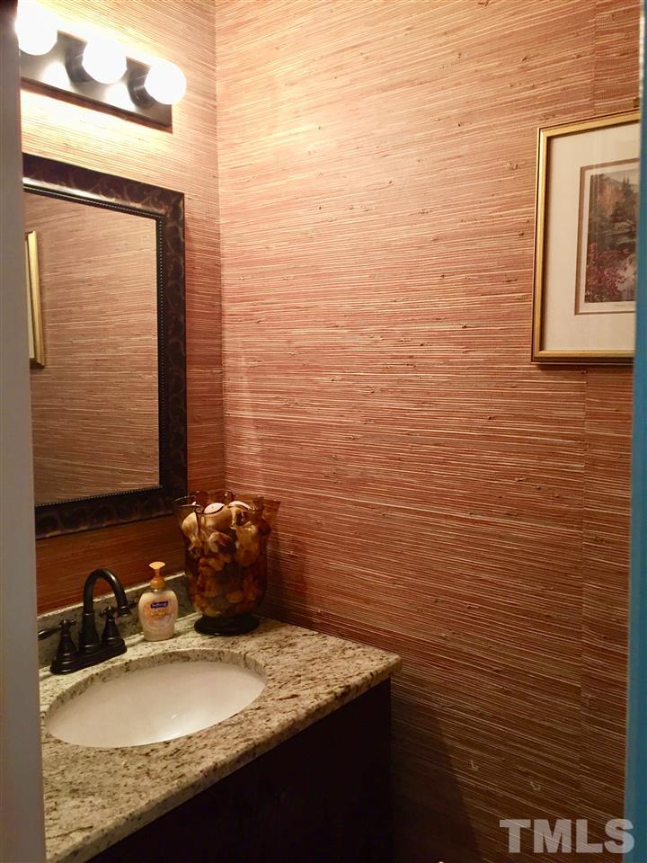 11917 Eagle Bluff Circle Raleigh, NC 27613 - Photo 10 of 25 a bathroom with a granite countertop sink a toilet and mirror