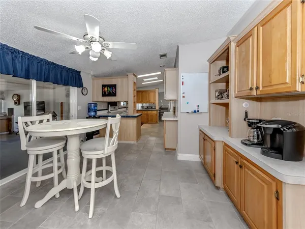 a kitchen with stainless steel appliances a sink stove and cabinets