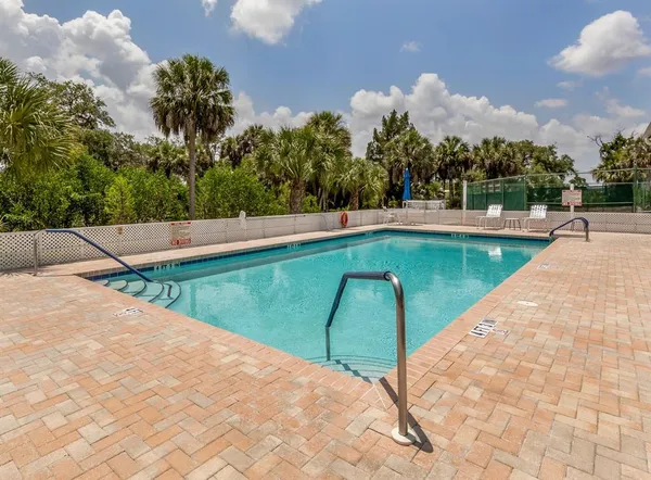 a view of swimming pool with a yard