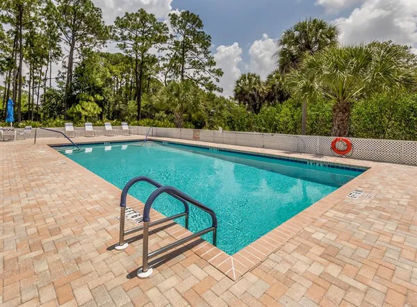 a view of swimming pool with a backyard