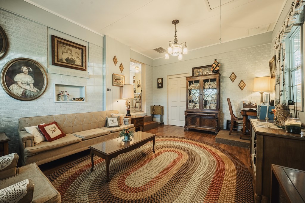 622 Lower Bogard Road Newport, TN 37821 - Photo 15 of 34 a living room with furniture a fireplace and a chandelier
