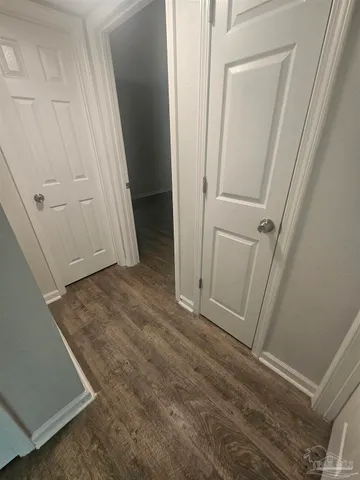 a view of room with window and hardwood floor