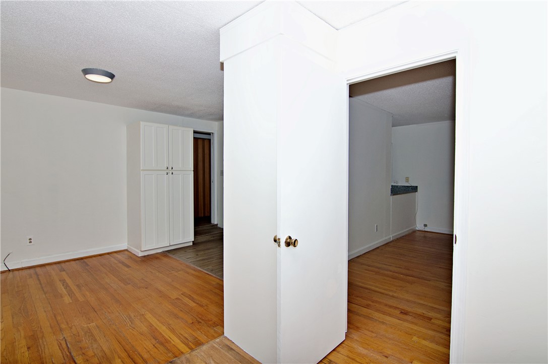 102 Broad Street Clemson, SC 29631 - Photo 6 of 40 Natural wood floors extend throughout this flexible space, offering a clean canvas for personalized design.