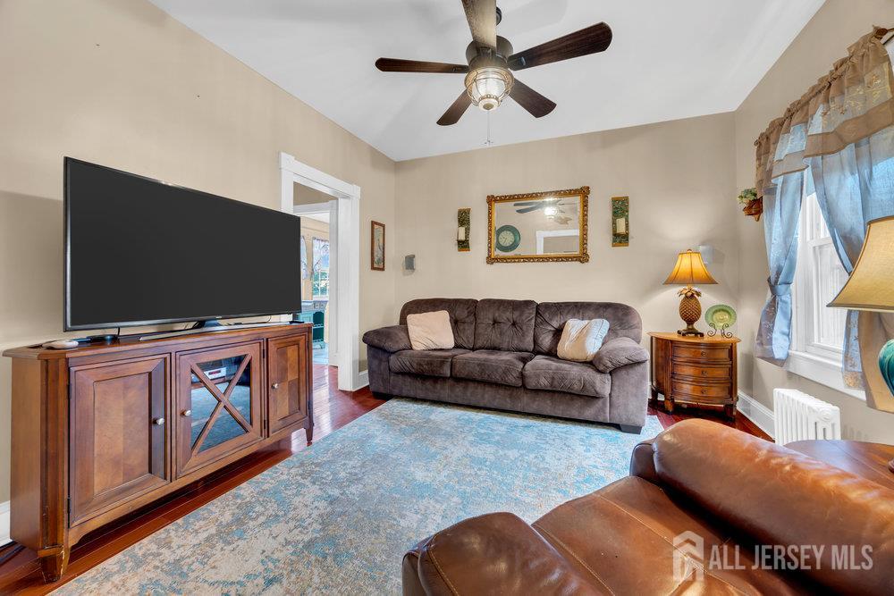 98 William Street South River, NJ 08882 - Photo 11 of 52 a living room with furniture and a flat screen tv