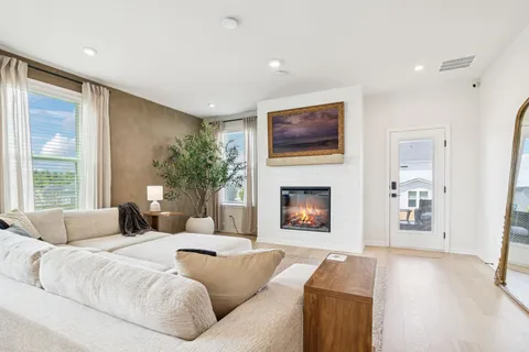 a spacious bedroom with a large bed and a couch