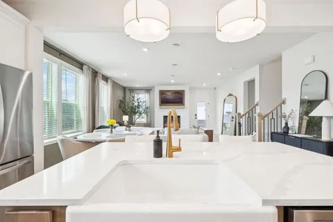 a view of a living room and kitchen
