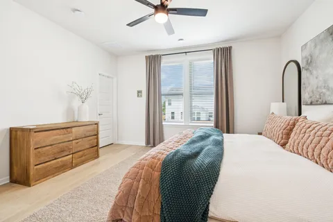 a bedroom with a bed and a dresser