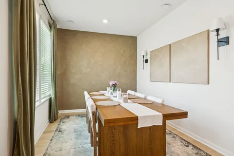 a view of a kitchen from a hallway
