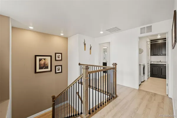 a view of a hallway with workspace and entryway