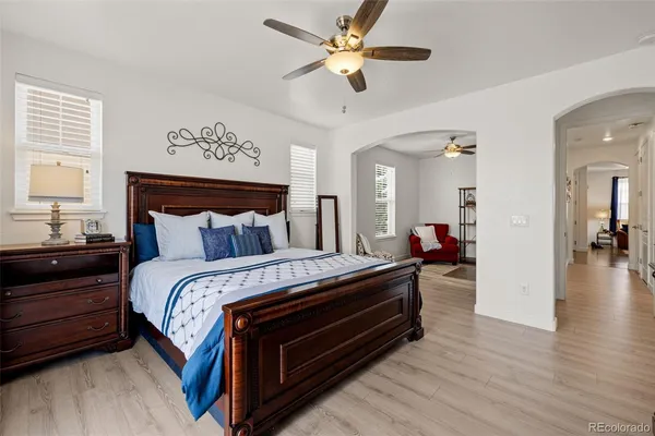 a bed room with bed and a chandelier