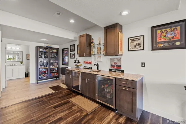 a open kitchen with stainless steel appliances granite countertop a stove and cabinets