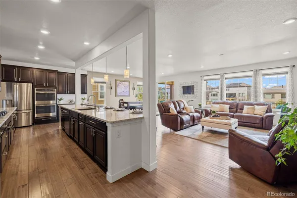 a large kitchen with stainless steel appliances lots of counter top space