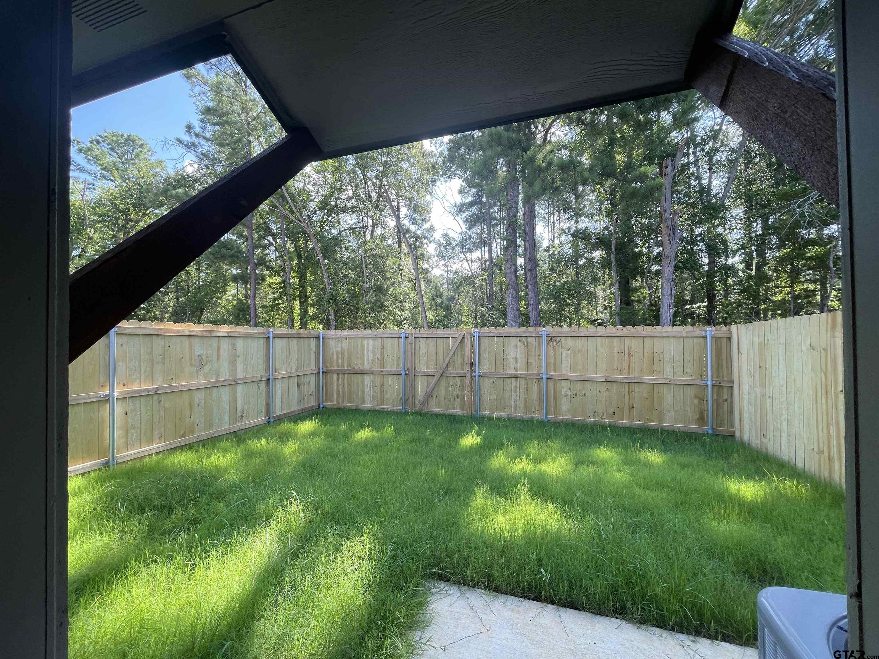 4074 W Creek, Unit 18 Tyler, TX 75703 - Photo 11 of 11 a view of yard with green space