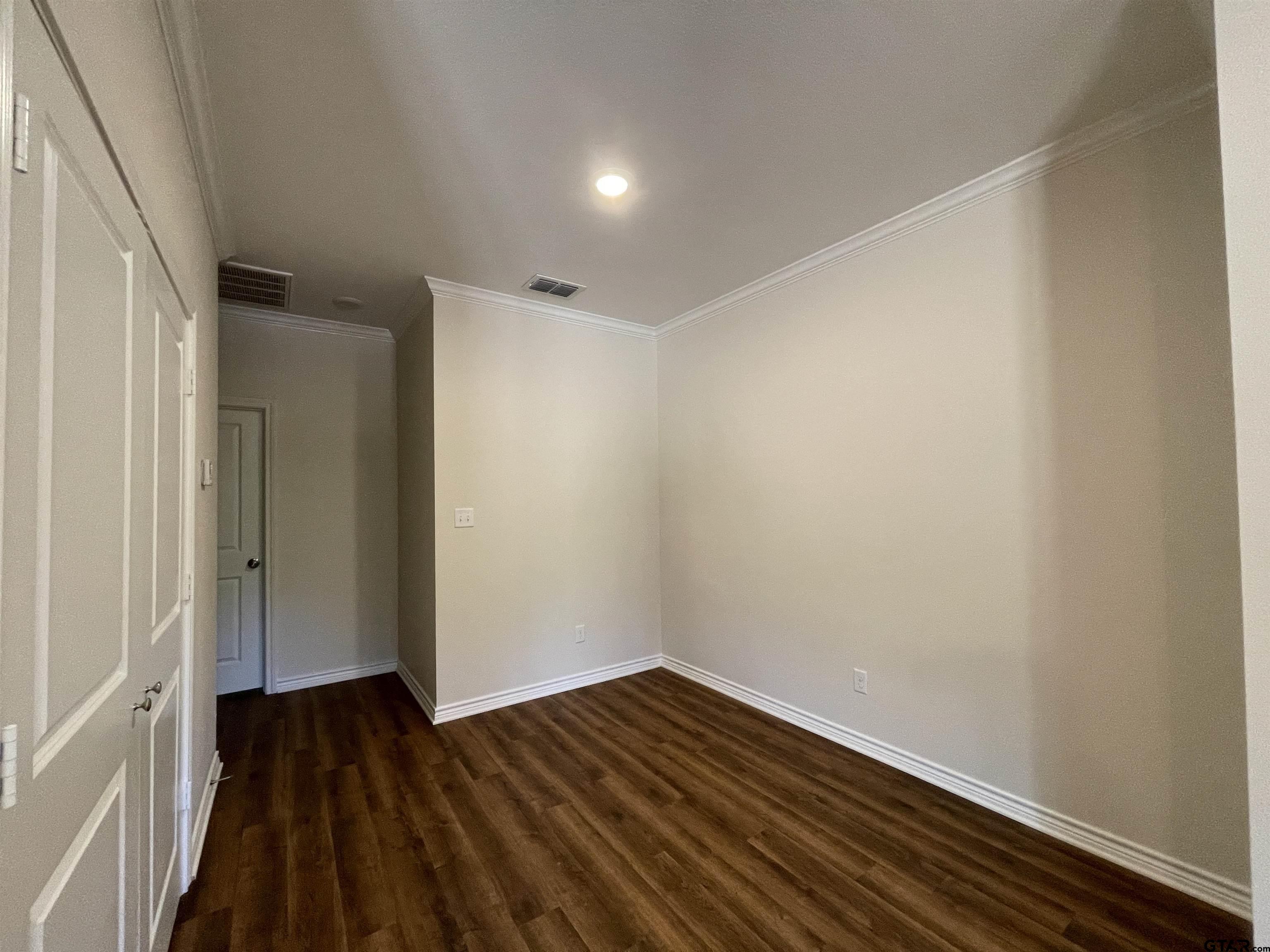 4074 W Creek, Unit 18 Tyler, TX 75703 - Photo 3 of 11 a view of wooden floor
