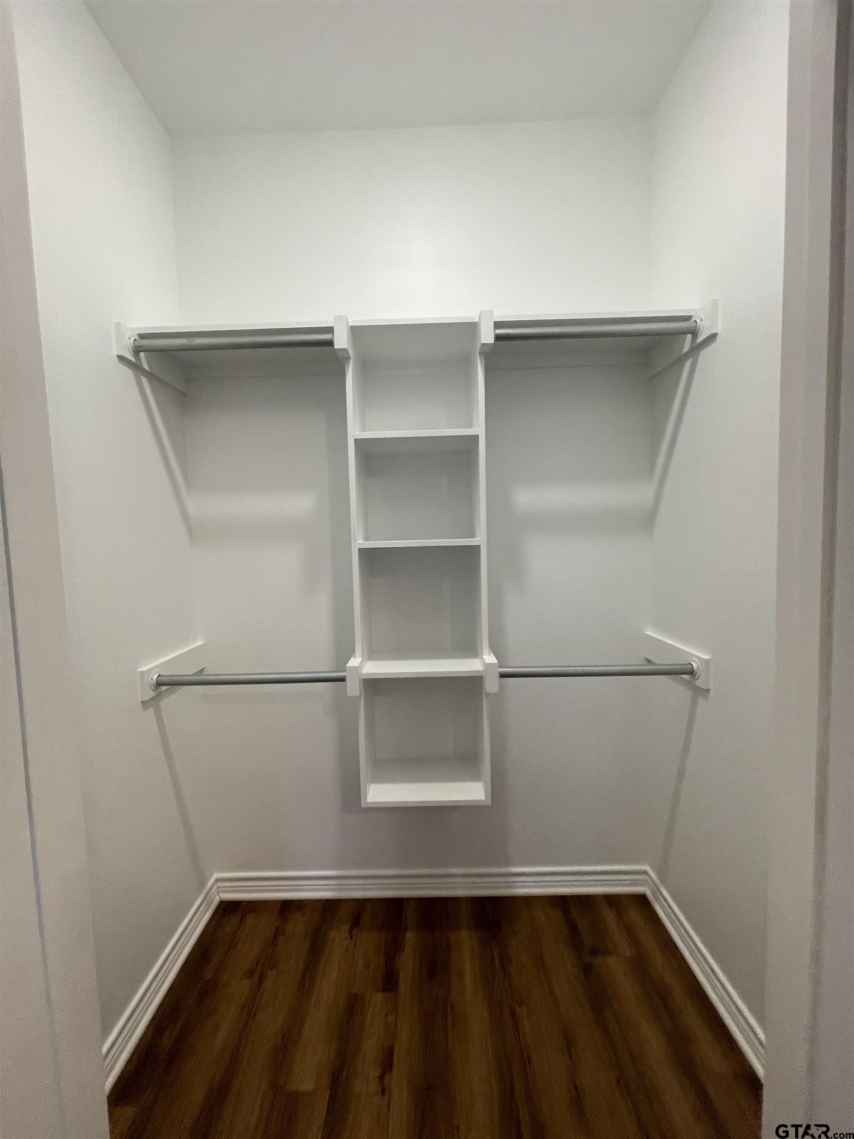 4074 W Creek, Unit 18 Tyler, TX 75703 - Photo 10 of 11 a view of an empty walk in closet