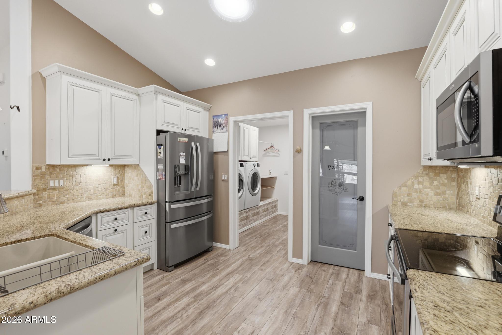 202 North Durango Court Payson, AZ 85541 - Photo 11 of 27 a kitchen with stainless steel appliances granite countertop a refrigerator and a stove top oven