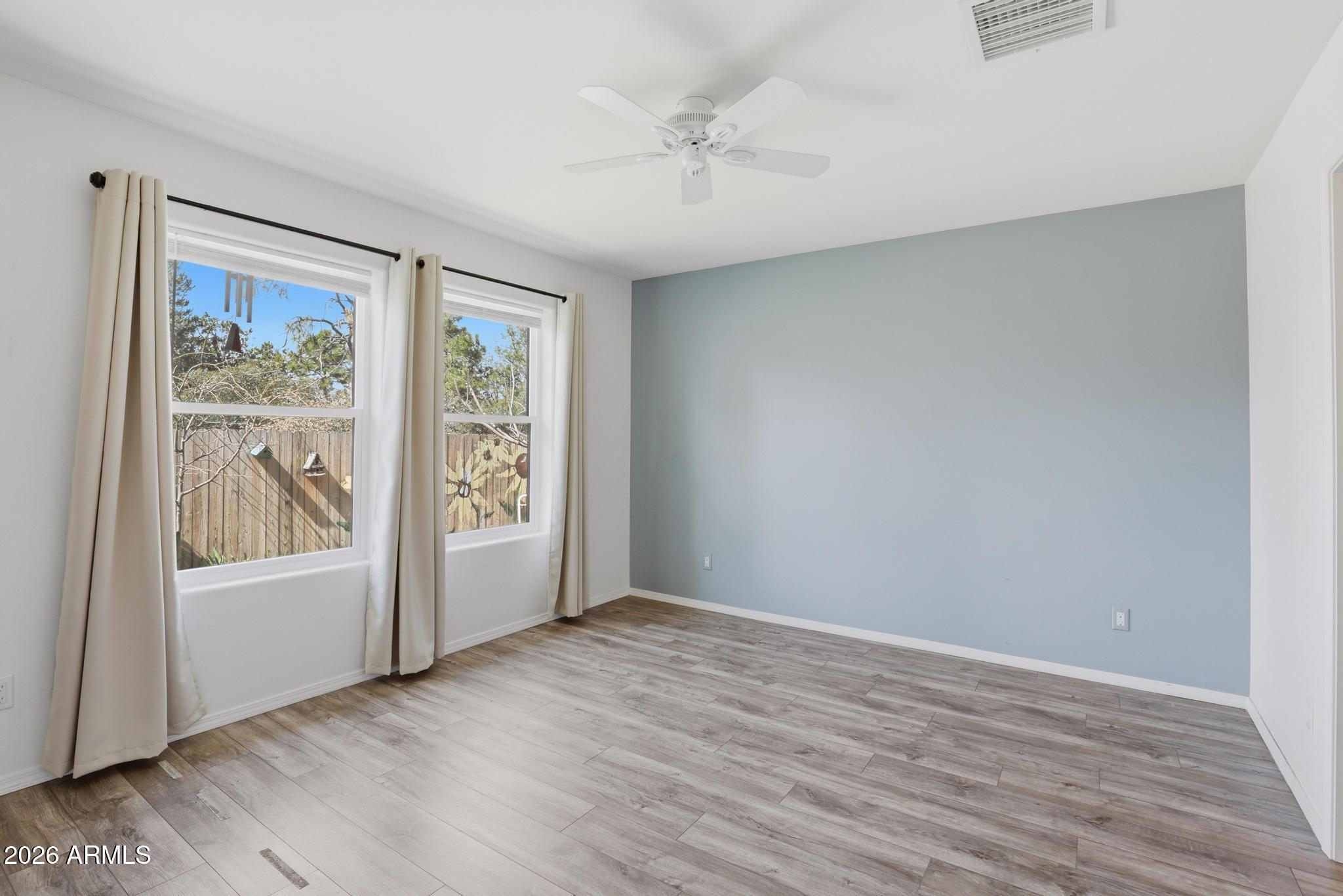 202 North Durango Court Payson, AZ 85541 - Photo 13 of 27 wooden floor in an empty room with a window