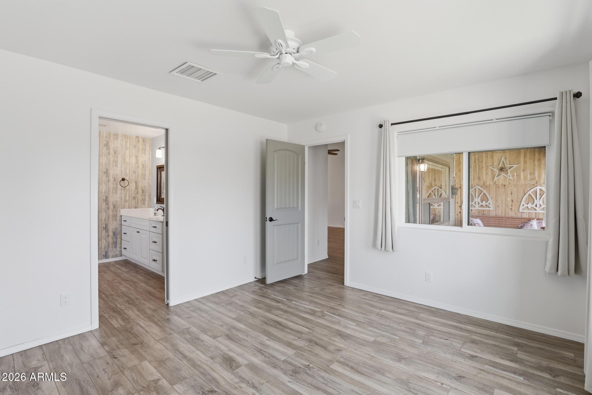 202 North Durango Court Payson, AZ 85541 - Photo 14 of 27 a view of an empty room with wooden floor and a window