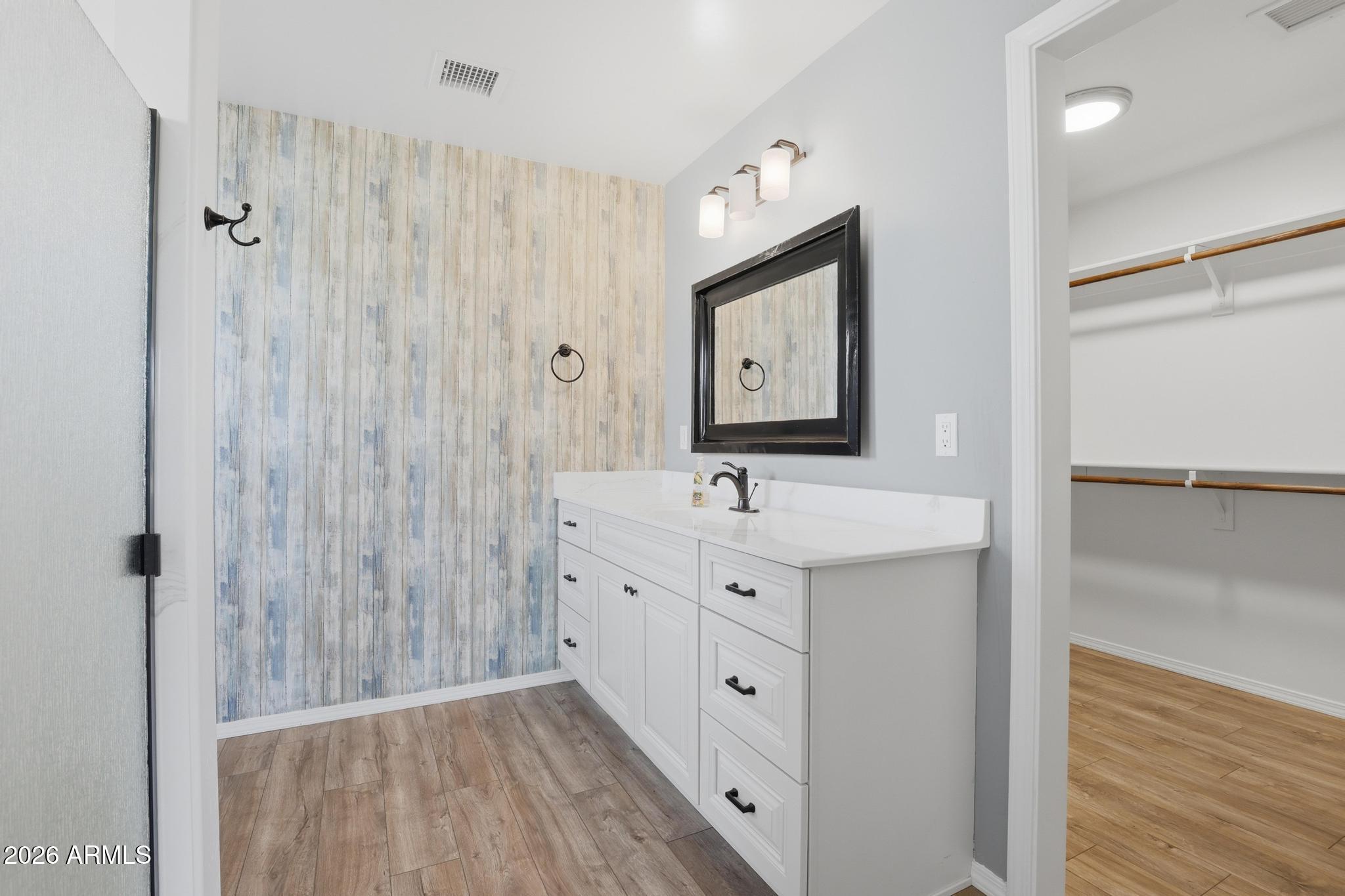 202 North Durango Court Payson, AZ 85541 - Photo 15 of 27 a bathroom with a double vanity sink a mirror and shower