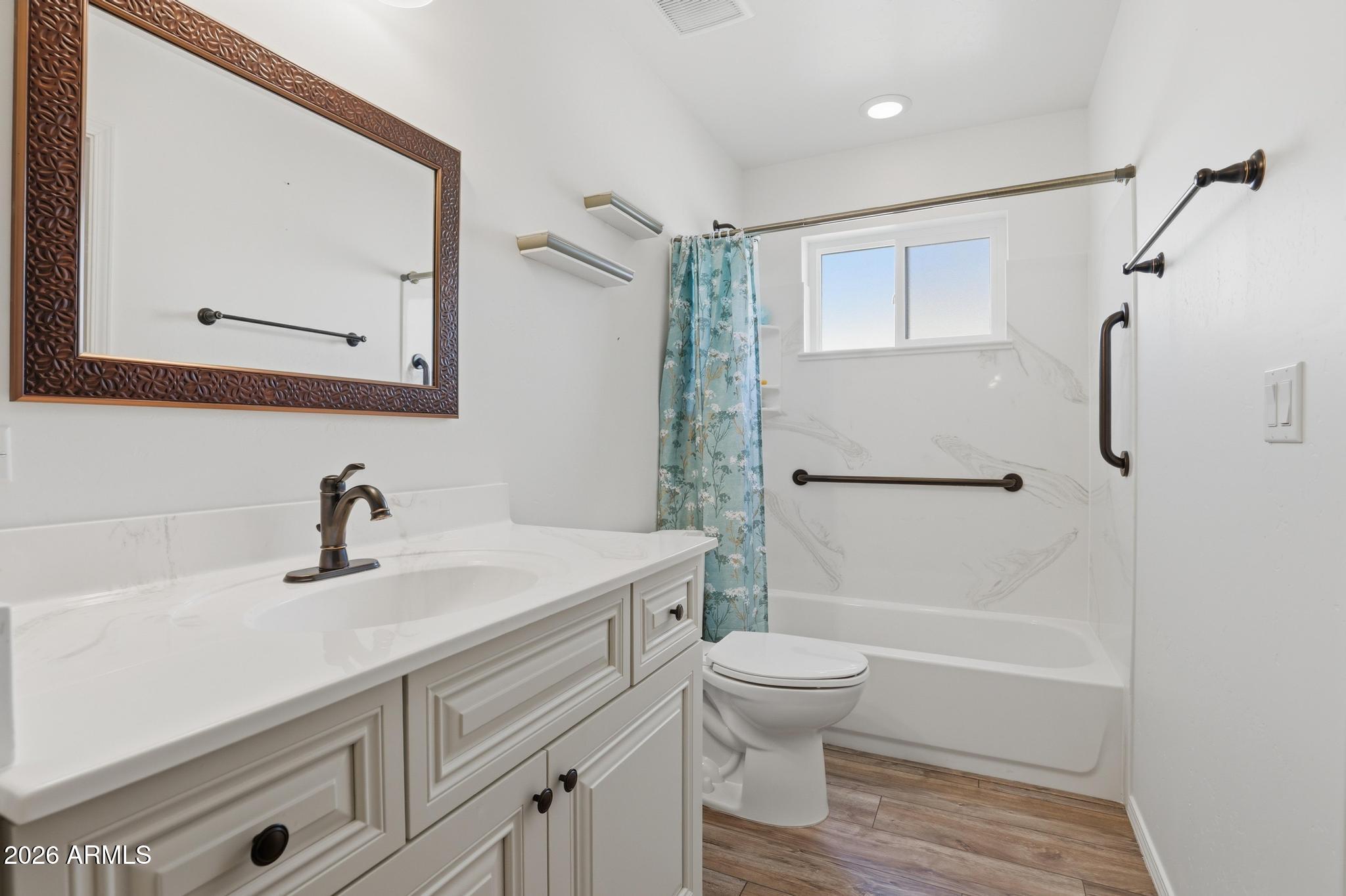 202 North Durango Court Payson, AZ 85541 - Photo 19 of 27 a bathroom with a sink a toilet and shower