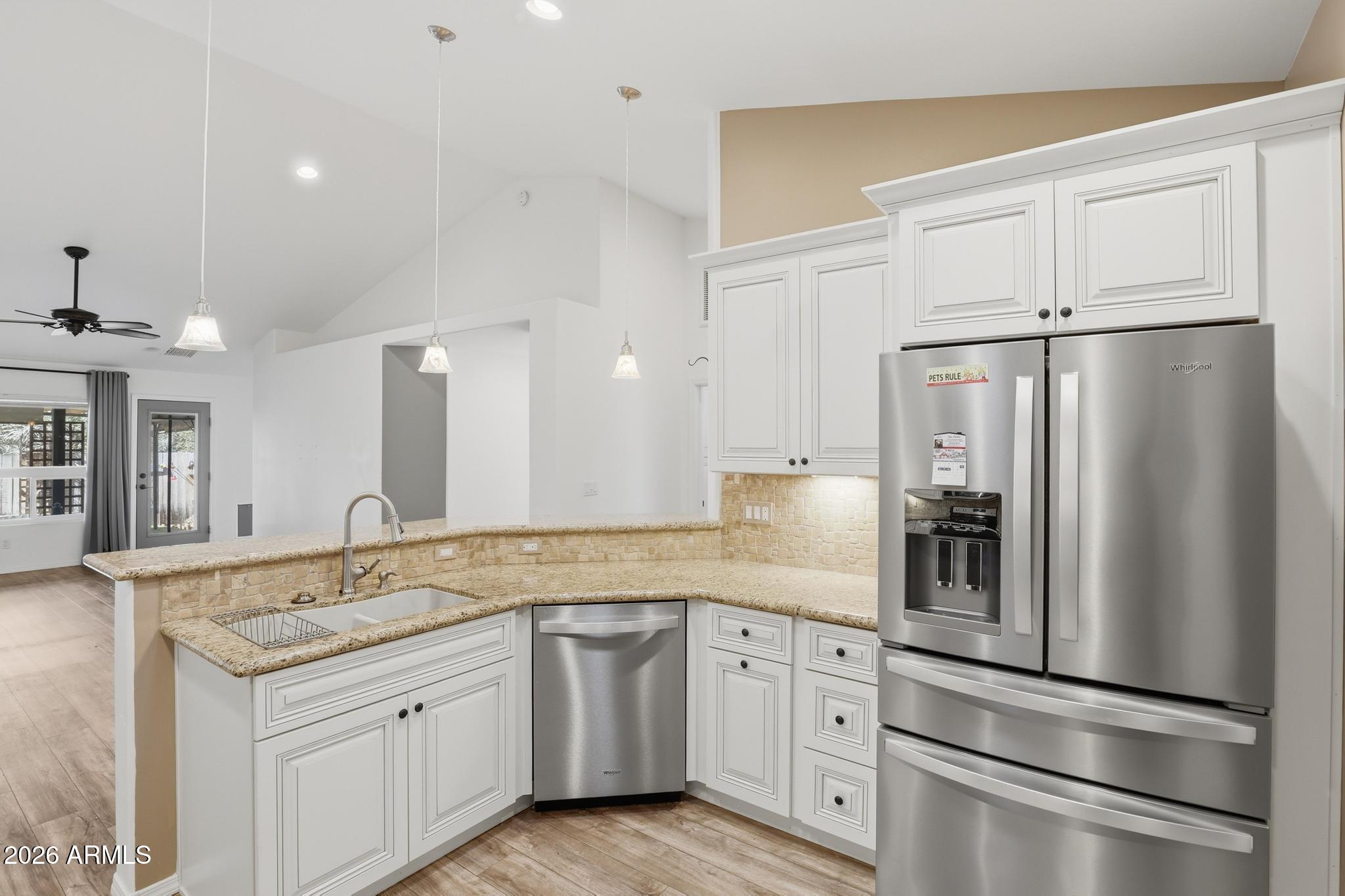 202 North Durango Court Payson, AZ 85541 - Photo 9 of 27 a kitchen with a refrigerator sink and cabinets
