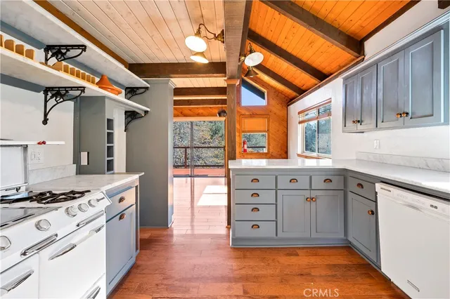 a kitchen with stainless steel appliances granite countertop a stove and a sink