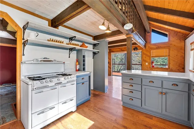 a kitchen with stainless steel appliances granite countertop a stove and a refrigerator