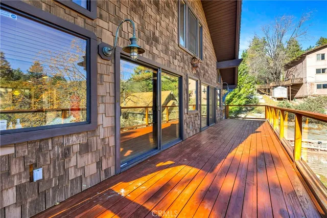a view of balcony with wooden floor