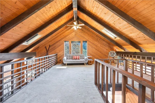a view of balcony with stairs and wooden floor