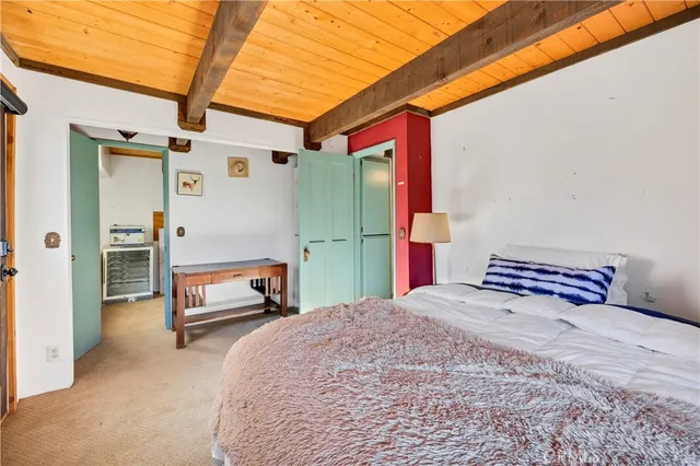 a bedroom with a bed and a table