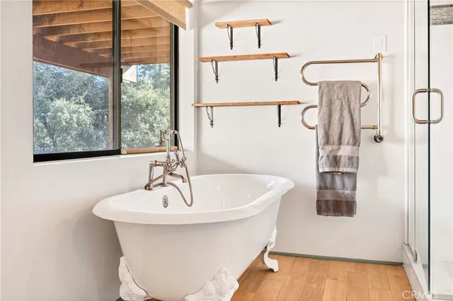 a bathroom with a bathtub and shower