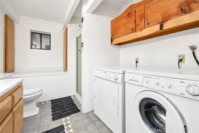 a view of a hallway with washer and dryer