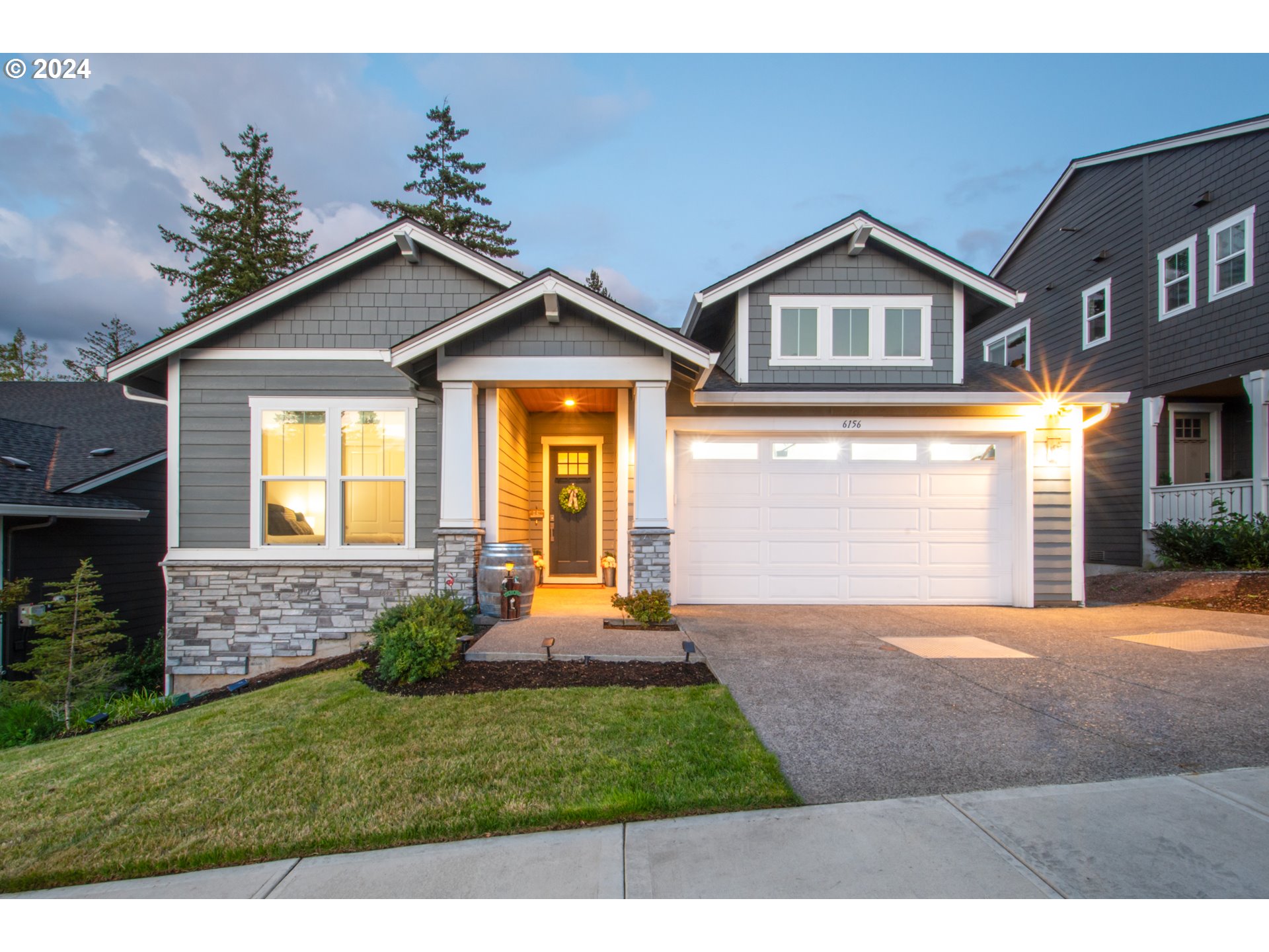 6156 Northwest Olympic Street Camas, WA 98607 - Photo 1 of 29 a front view of a house with a yard and garage