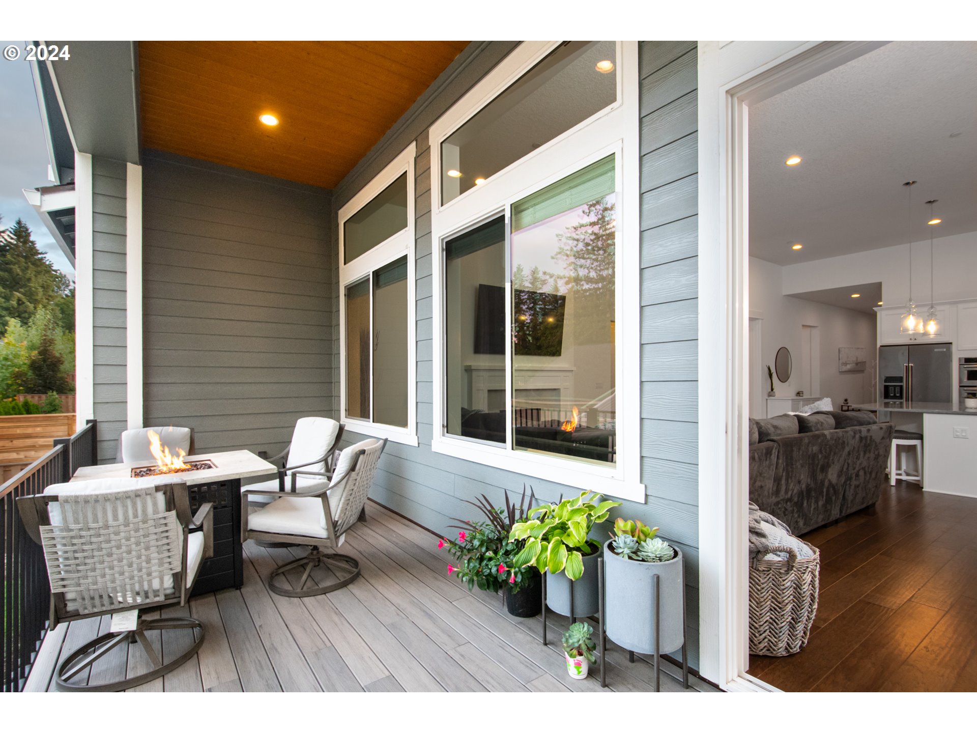 6156 Northwest Olympic Street Camas, WA 98607 - Photo 14 of 29 a balcony with table and chairs and potted plants
