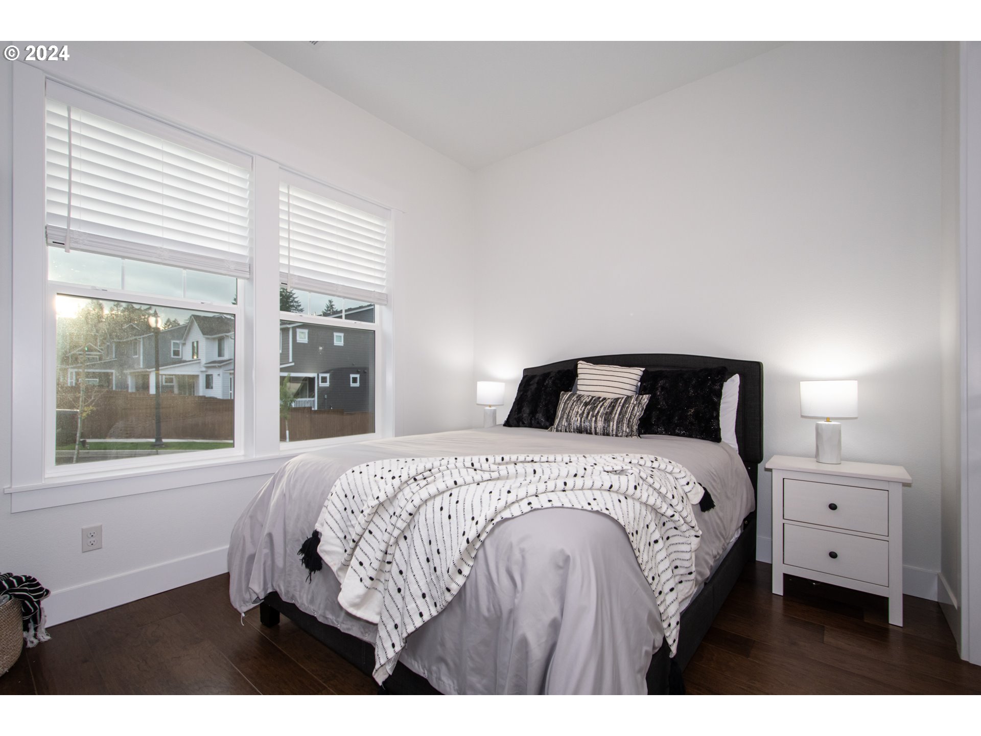 6156 Northwest Olympic Street Camas, WA 98607 - Photo 25 of 29 a bedroom with a bed and a large window