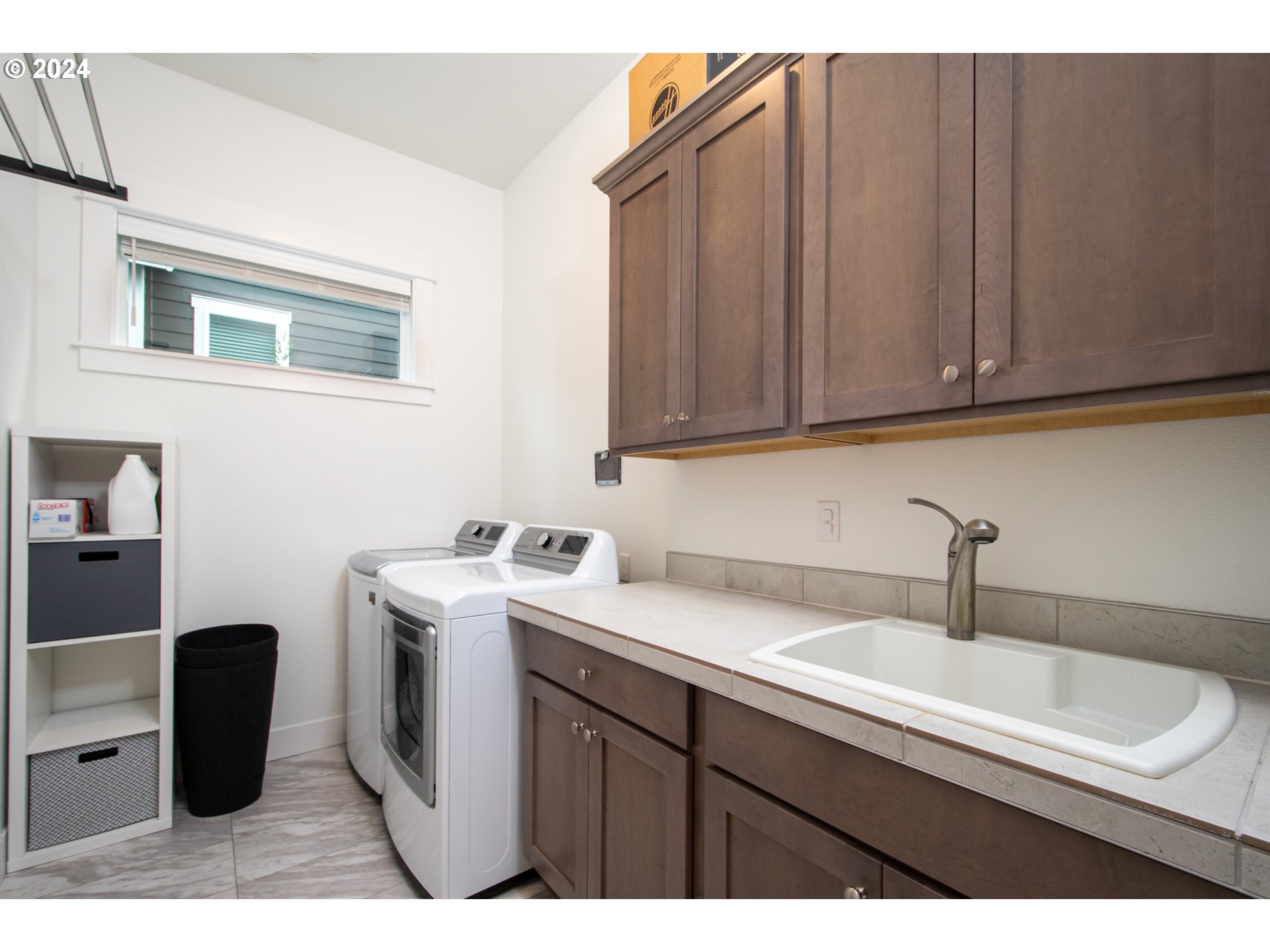 6156 Northwest Olympic Street Camas, WA 98607 - Photo 26 of 29 a kitchen with a sink cabinets and appliances