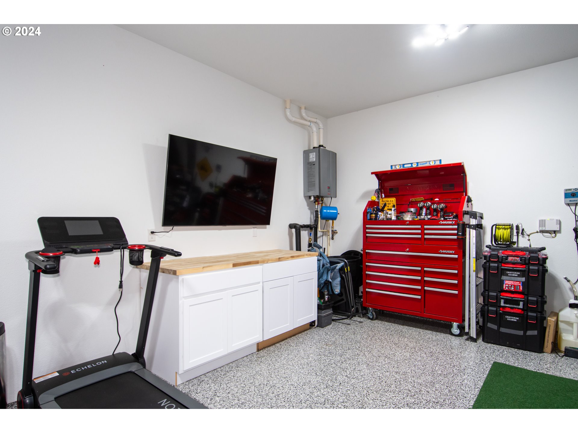 6156 Northwest Olympic Street Camas, WA 98607 - Photo 28 of 29 a living room with furniture and a flat screen tv