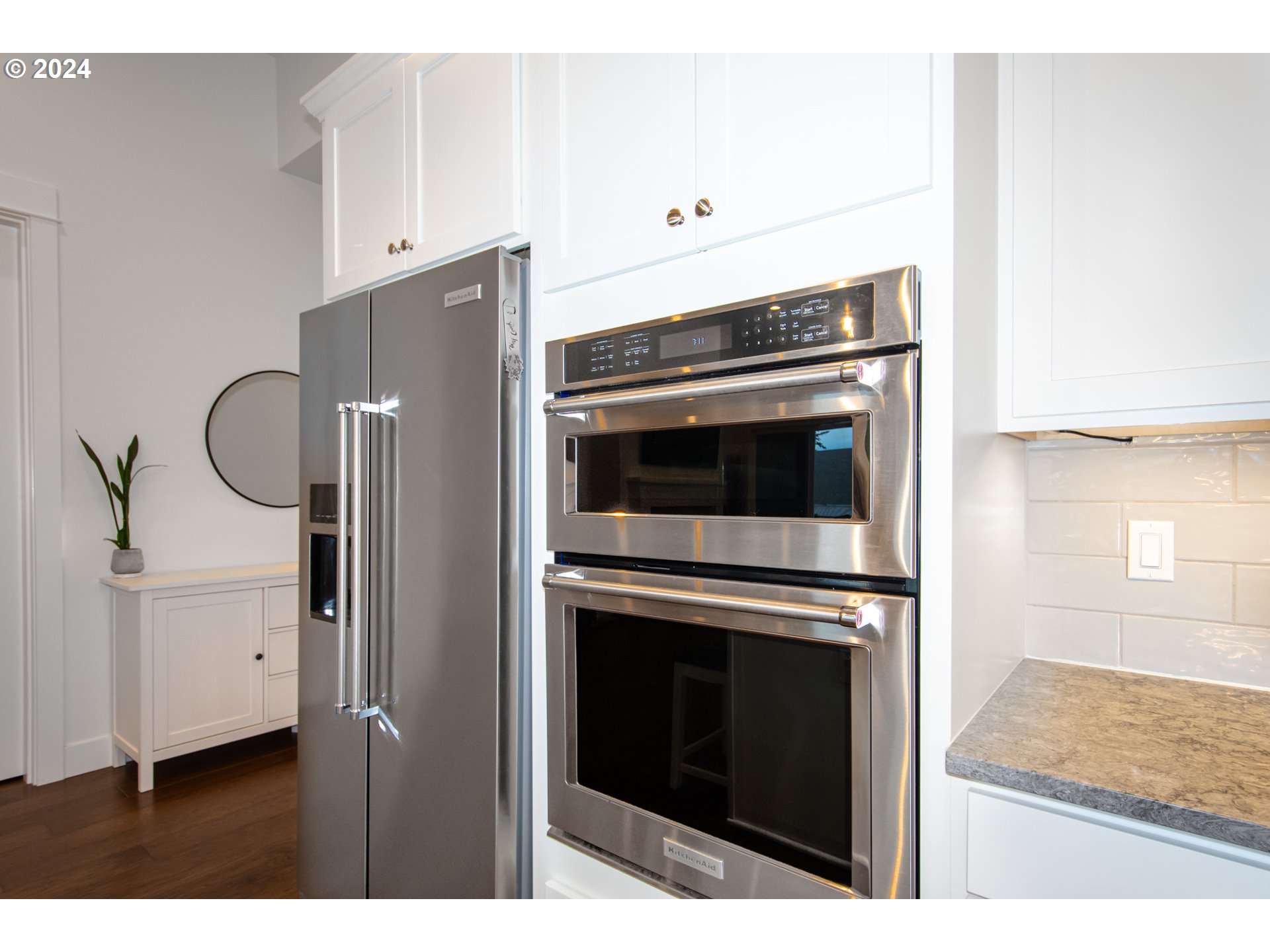 6156 Northwest Olympic Street Camas, WA 98607 - Photo 10 of 29 a kitchen with granite countertop cabinets and steel stainless steel appliances
