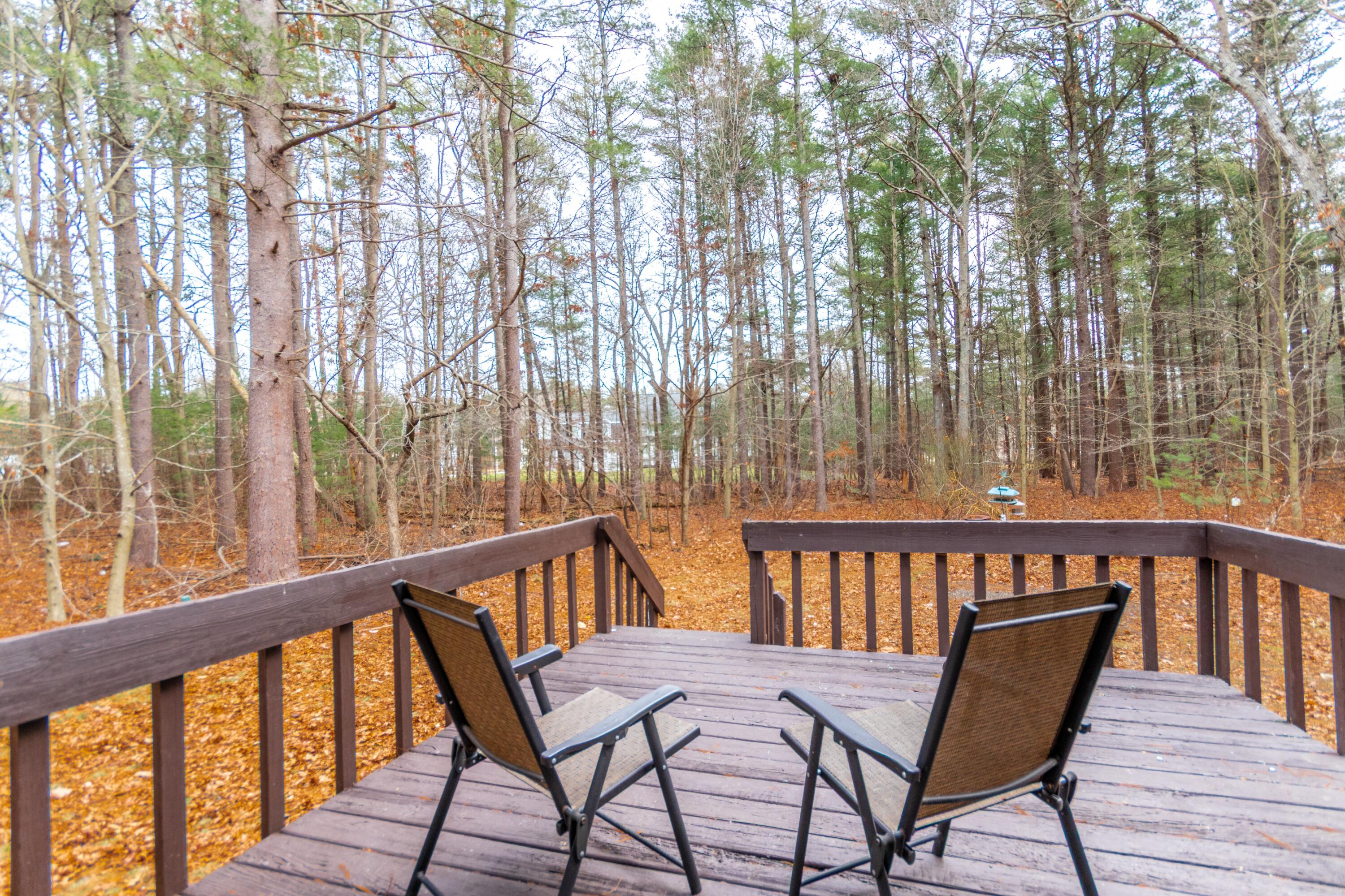 173 Titicut Road Raynham, MA 02767 - Photo 4 of 7 a view of a two chairs and table in the balcony