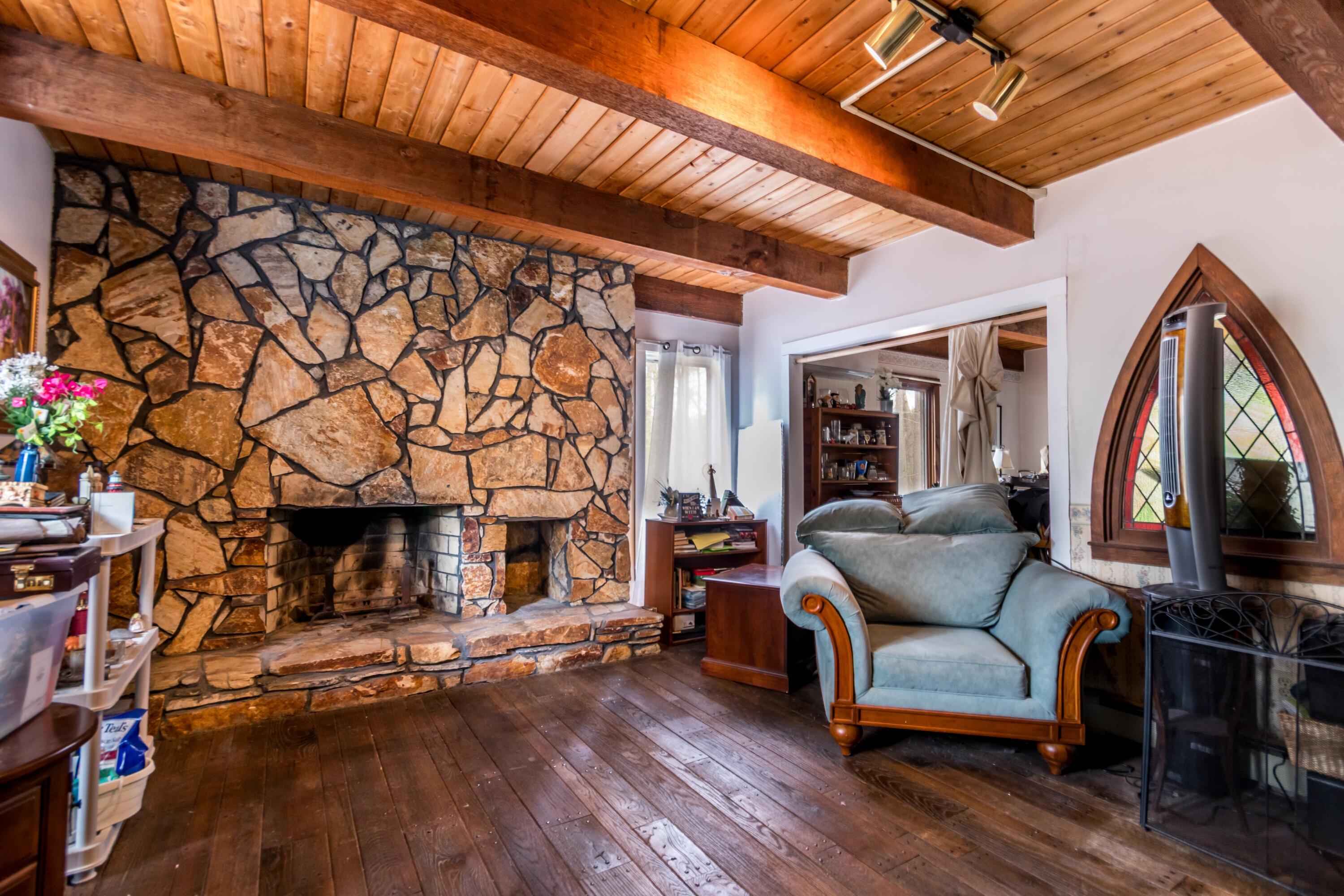 173 Titicut Road Raynham, MA 02767 - Photo 5 of 7 a living room with furniture and a fireplace